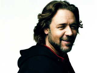 Man beard black jacket smiling 4 - a white backdrop free wallpaper