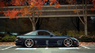 Car parked parking lot building 3 - a parking lot next free wallpaper