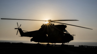 Helicopter sun clouds ocean flying - a helicopter free wallpaper