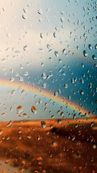 Rainbow rain covered window background - a rainbow free wallpaper