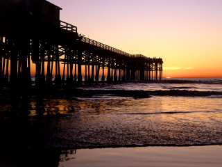 Pier sunset waves crashing person 2 - a pier free wallpaper
