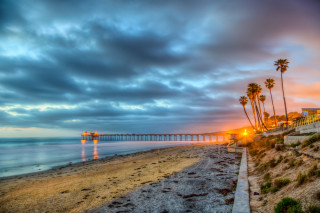 Beach pier palm trees sunset - a few building free wallpaper
