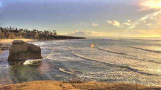 Beach cliff water waves sun - wave free wallpaper