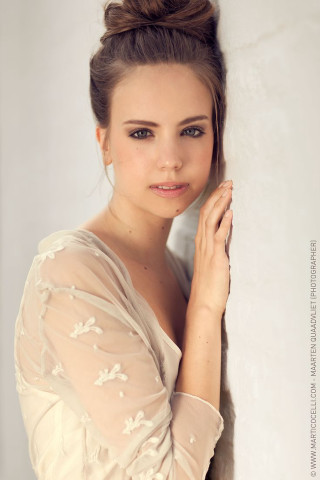 Woman bun hair leaning wall - eszter mattioni free wallpaper