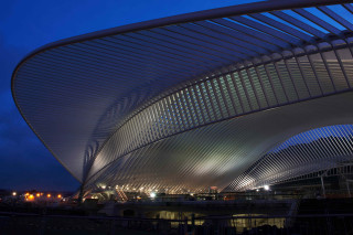 Large building curved roof nighttime - modernism free wallpaper