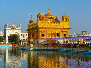 Golden building water people bridge - a bridge in the background free wallpaper