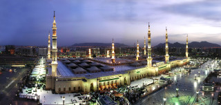 Large building lights people walking - panoramic view free wallpaper
