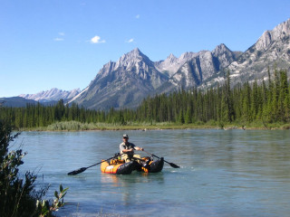 Man paddling raft river mountains - a man free wallpaper