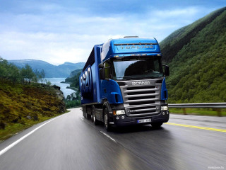 Blue semi truck mountain lake - a lake in the background free wallpaper