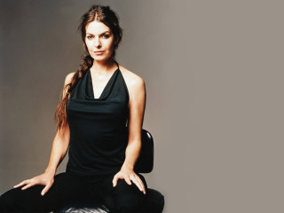 Woman sitting chair hands pockets - a portrait free wallpaper