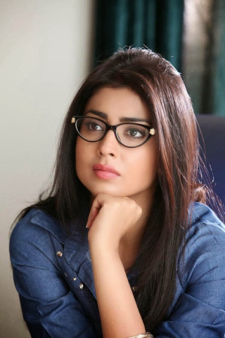 Woman glasses sitting chair looking - movie still frame free wallpaper