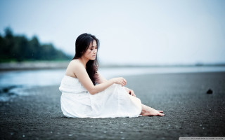 Woman white dress sitting water - her phone free wallpaper