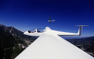 Small plane mountain range flying - a small plane free wallpaper