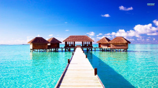 Pier huts ocean blue sky - clear blue water free wallpaper