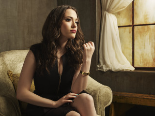 Woman sitting chair hand chin 2 - a window in the background free wallpaper