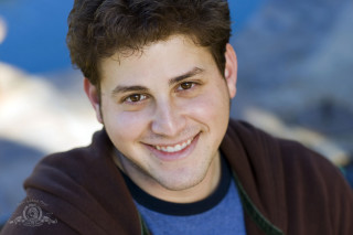 Man brown jacket smiling mountain - david lazar free wallpaper