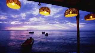 Boat sitting water lights dusk - a boat in the distance free wallpaper