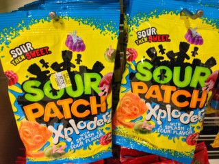 Sour patch snacks store display - explosion free wallpaper