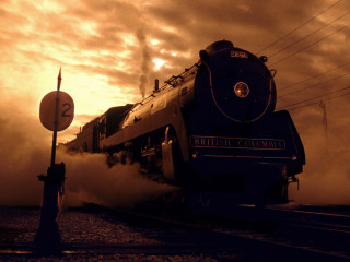 Train smoke tracks street sign - a train free wallpaper