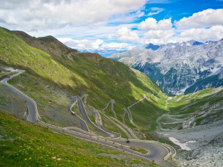 Winding road mountains car driving - a mountain range in the background free wallpaper