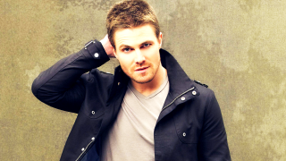 Man black jacket holding head - everett warner free wallpaper
