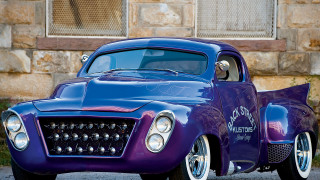 Purple car parked building window 2 - a purple car free wallpaper