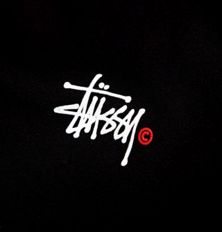 Black shirt red circle astronaut - white lettering free wallpaper