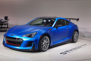 Blue sports car showroom white - real life skin free wallpaper