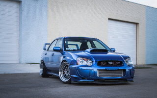 Blue subaru garage white wall - glossy free wallpaper