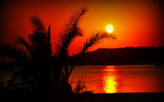 Sunset red sky water boat - a sunset free wallpaper