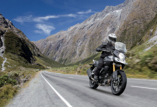 Man motorcycle curvy road mountains - weta digital free wallpaper