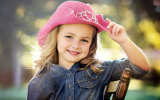 Little girl pink hat smiling 3 - a little girl free wallpaper