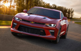 Red chevrolet camaro sunset road - in the foreground free wallpaper