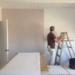 Man painting wall ladder bedroom - a wall free wallpaper