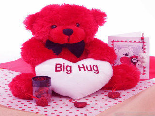 Red teddy bear holding heart - a cross stitch free wallpaper