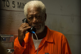 Man orange shirt talking phone - a cord free wallpaper
