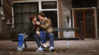 Man woman bench cellphone luggage - a man and woman free wallpaper