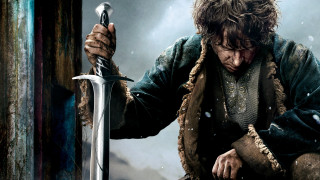 Man holding sword looking down - weta digital free wallpaper