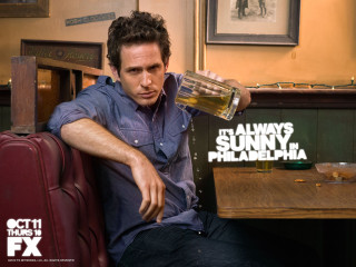 Man sitting table beer sign - promotional image free wallpaper