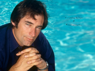 Man blue shirt pool edge - david annand free wallpaper