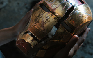 Person holding cracked helmet with - cracked free wallpaper