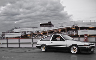White black car parked building - car free wallpaper