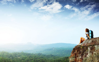 Person sitting rock mountains trees - ella guru free wallpaper