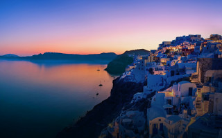 Town cliff sunset water view - a view of a town free wallpaper