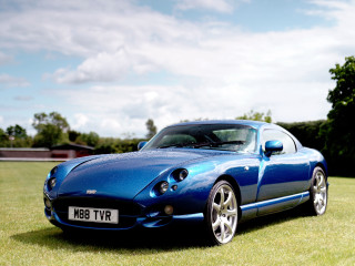 Blue sports car grass field 3 - david imms free wallpaper