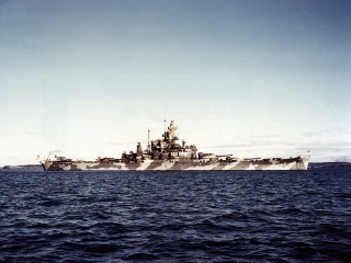 Battleship floating water shoreline boat - a boat in the distance free wallpaper