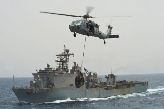 Helicopter lifting ship water shore - a ship free wallpaper
