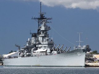 Battleship docked water dock building - a large battleship free wallpaper