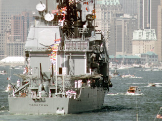 Large ship water city boats - a large city in the background free wallpaper