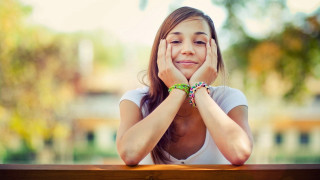 Girl smiling bench hands face - her face free wallpaper